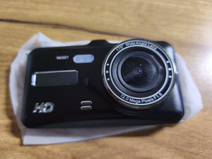 Digital camera on a wooden surface