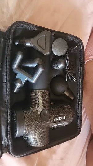 Set of grooming tools in a black case on a light pink background