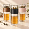 Three SipEase 200ml tea infuser bottles in wood, black, and pink