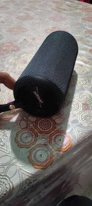 Black sunglasses case on a patterned tablecloth