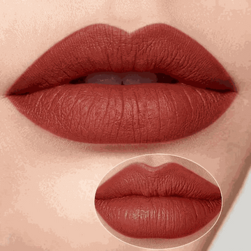 Close-up of a person's lips wearing a red lipstick with a magnified inset showing texture details.