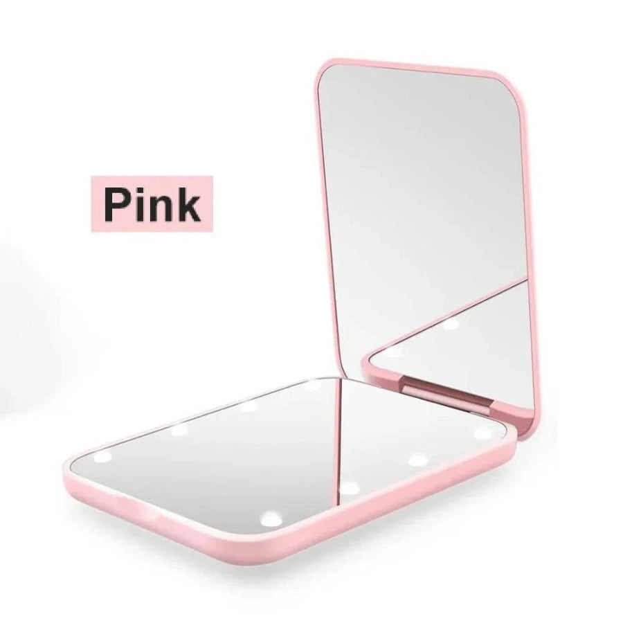 Pink compact mirror on a white background with 'Pink' label.