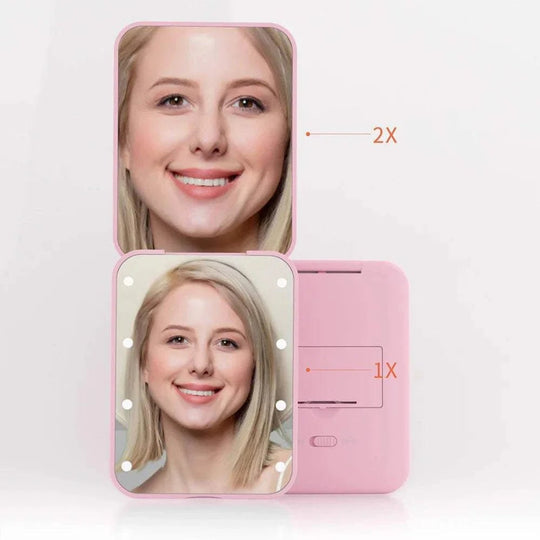 Pink makeup mirror with LED lights showing a woman&