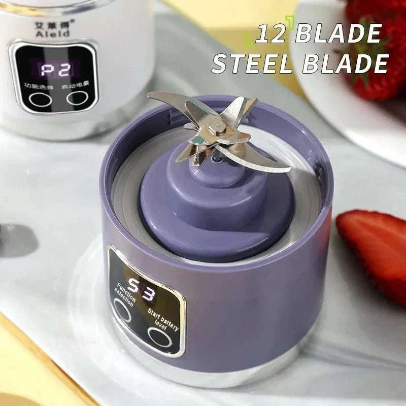 Purple blender with a metal blade on a white surface, with text indicating '12 Blade Steel Blade'.