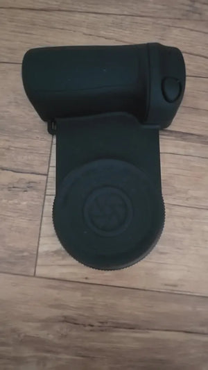 Black binoculars on a wooden floor