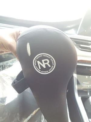 Black headrest cover with a logo in a car interior