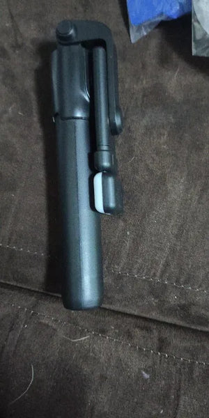 Black pen-like device on a textured surface