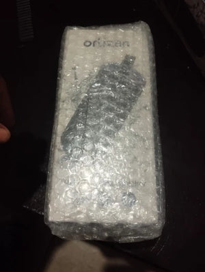 Product wrapped in bubble wrap with 'Orange' branding on a dark background