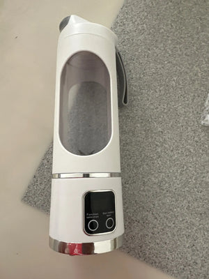 White and silver electronic device on a gray surface