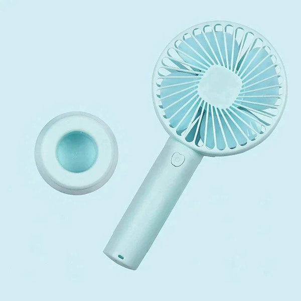 Portable hand fan with a light blue design on a matching background