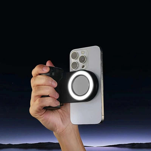 Hand holding a smartphone with a ring light attachment against a dark background