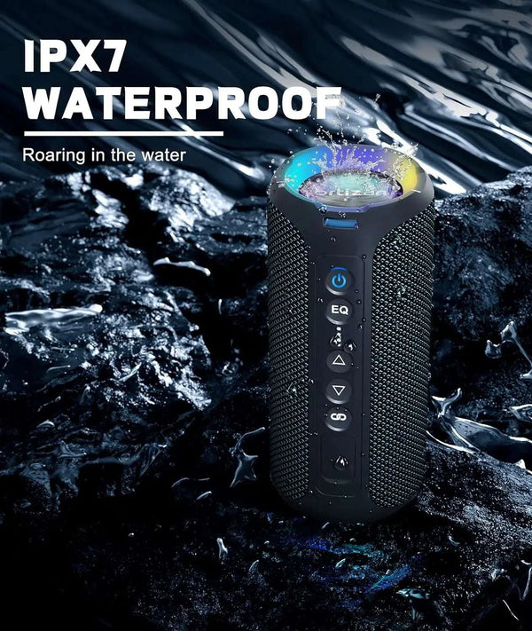 Waterproof speaker with IPX7 rating on a rocky surface with water.