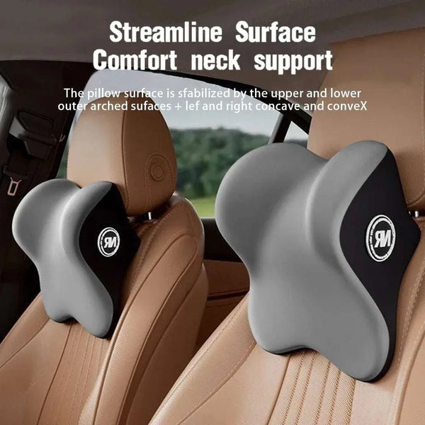 Car neck support pillow with 'SM' logo on a car seat